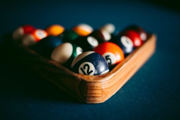 Multi-colored billiard balls on a blue table