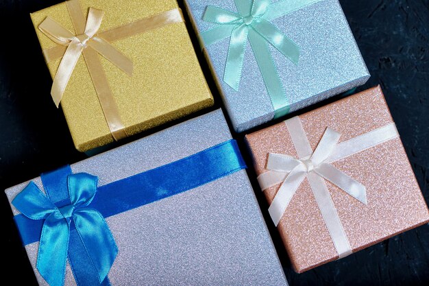 Multi colored gift boxes with bows different colors