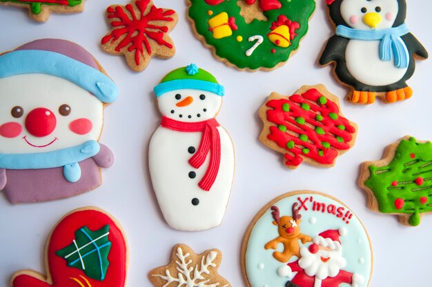 Multi colored gingerbread cookies during christmas on white background