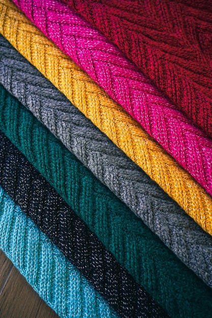 Разноцветный фон текстуры трикотажной шерстяной ткани для зимы