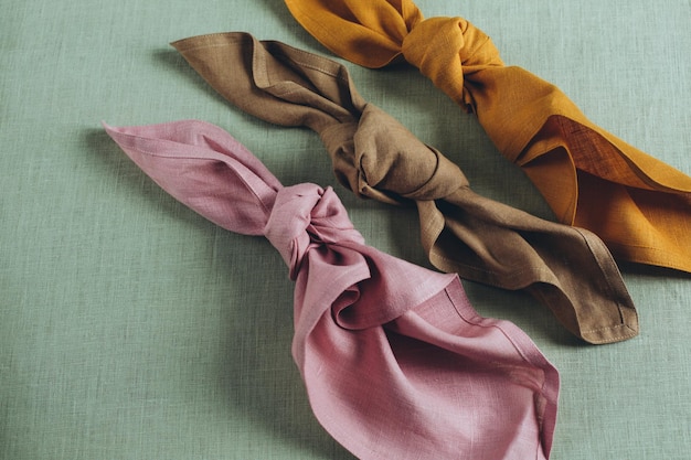 Multi-colored linen napkins lie on the table