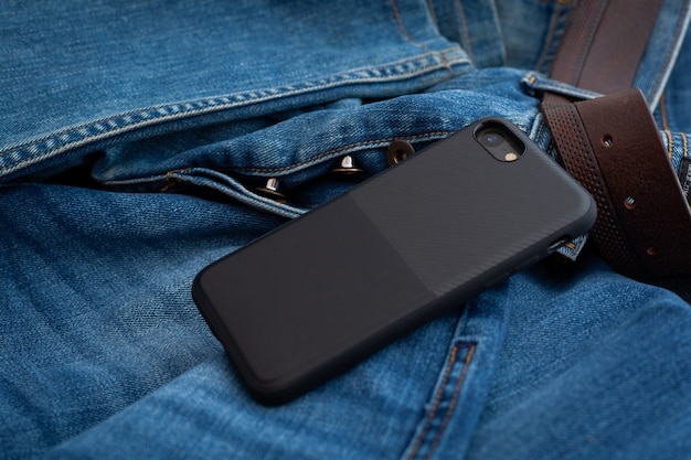 Photo multi-colored mobile phone case on a denim background