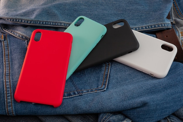 Multi-colored mobile phone case on a denim background