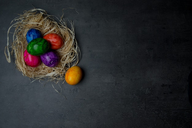 Multi-colored painted Easter eggs in a basket