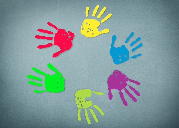 Multi colored painted hand prints  on background