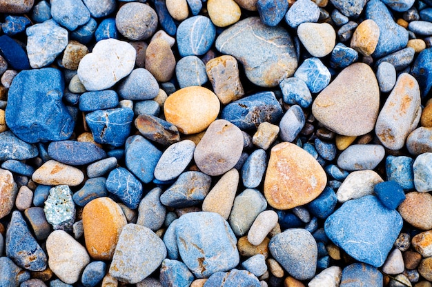 Multi colored pebbles rocks background