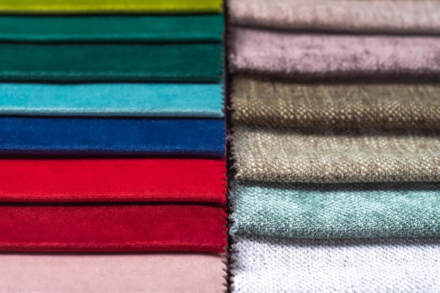 Multi colored set of upholstery fabric samples for selection\
collection of textile swatches