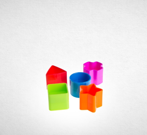 Multi colored toys against white background