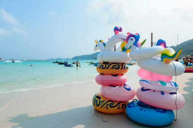 Multi colored umbrellas on beach against sky