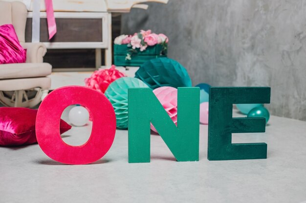 Multi-colored words "one" in the background