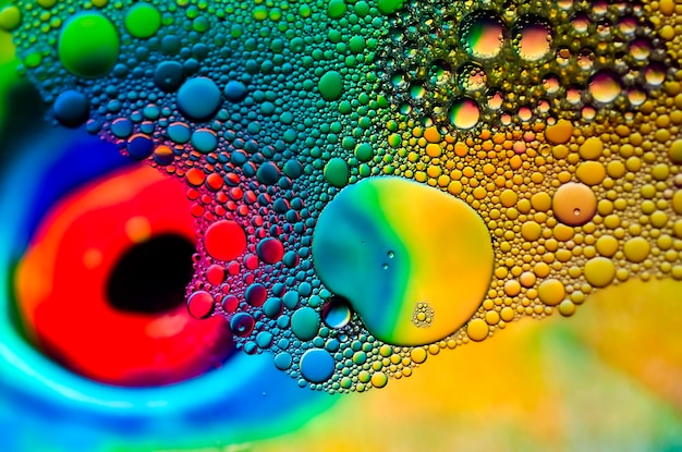 multi coloured and abstract background with bubbles and a bright color red eye at the background