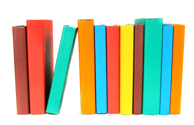 Multi-coloured books on a white background