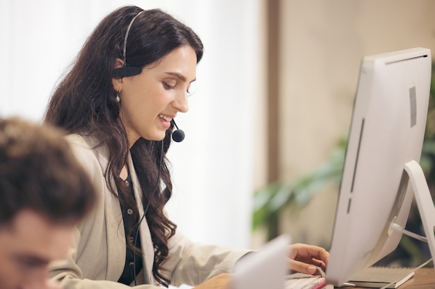 Multi-Cultural Business People Working In A Call Center, Online customer care support service.