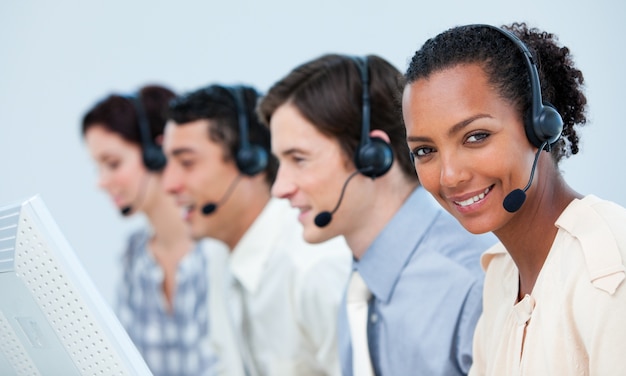 Multi-ethnic business people using headset 