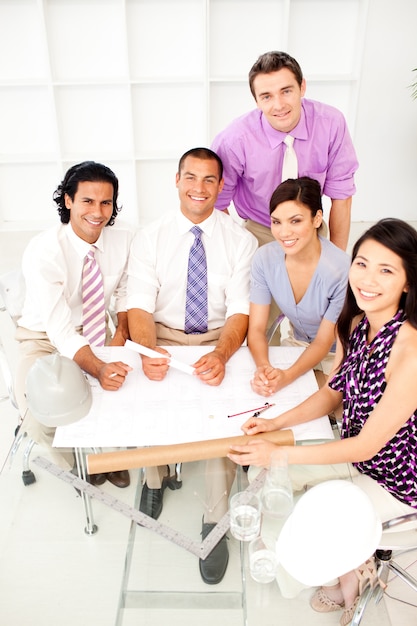 Multi-ethnic group of architects in a meeting