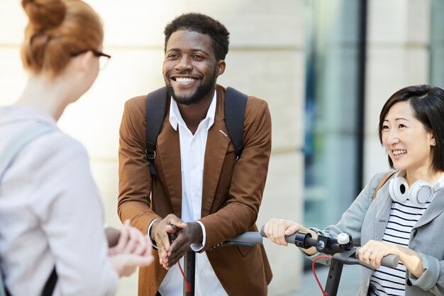 Multi-Ethnic Group of Friends Chatting in Street