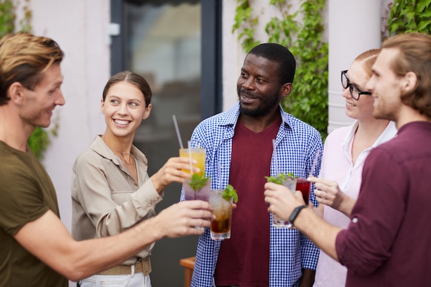 Multi-Ethnic Group of Friends Enjoying Drinks at Party