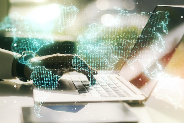 multi exposure of abstract creative digital world map and hand typing on computer keyboard on background research and analytics concept