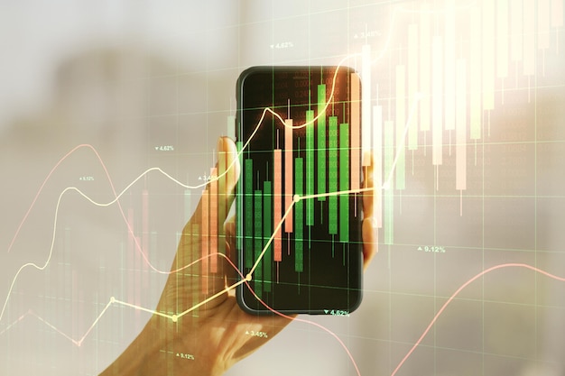 Multi exposure of abstract creative financial chart and hand with cell phone on background research and analytics concept