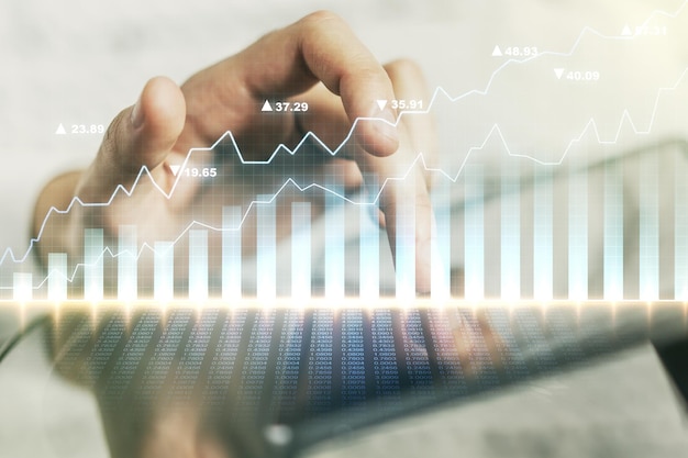 Multi exposure of abstract creative financial chart with finger presses on a digital tablet on background research and analytics concept