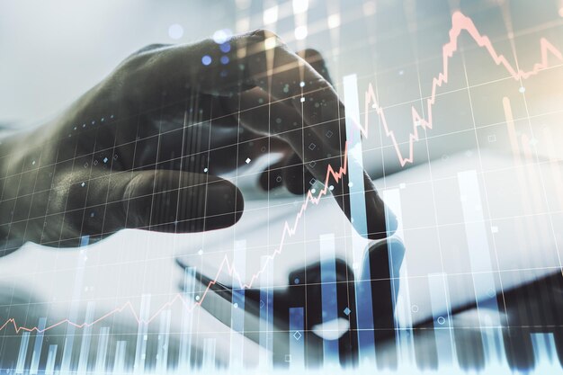 Multi exposure of abstract creative financial chart with finger presses on a digital tablet on background research and analytics concept