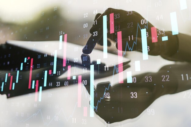 Multi exposure of abstract creative financial chart with finger presses on a digital tablet on background research and analytics concept