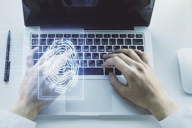 Multi exposure of abstract creative fingerprint illustration with hands typing on computer keyboard on background digital access concept