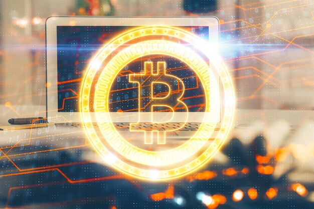multi exposure of blockchain and crypto economy theme hologram and table with computer background concept of bitcoin cryptocurrency