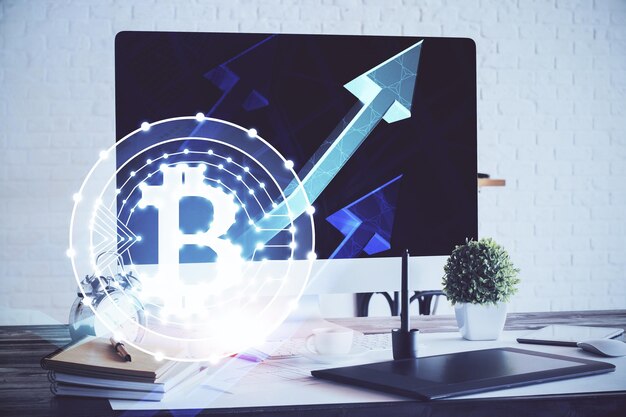 multi exposure of blockchain and crypto economy theme hologram and table with computer background concept of bitcoin cryptocurrency