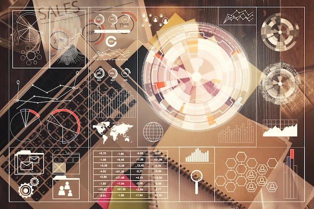 コンピューターとトップビューのワークデスクの背景にデータテーマ描画ホログラムの多重露光技術の概念
