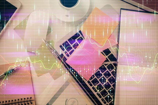 Photo multi exposure of financial chart drawing over table background with computer concept of research and analysis top view