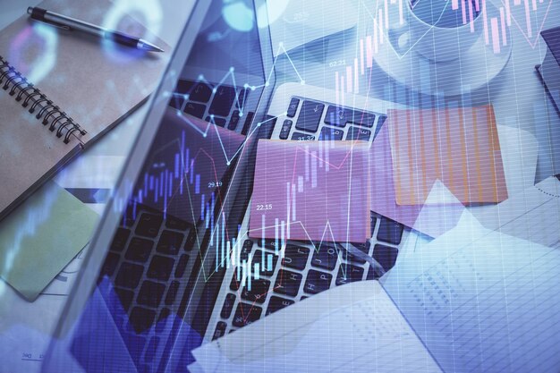 Photo multi exposure of financial chart drawing over table background with computer concept of research and analysis top view