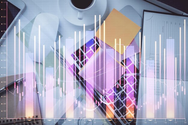 Multi exposure of financial chart drawing over table background with computer Concept of research and analysis Top view