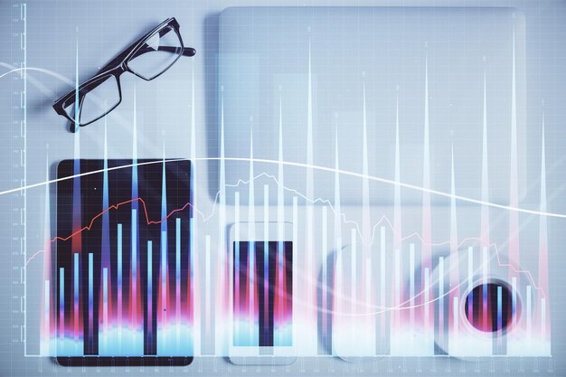 Multi exposure of financial chart hologram over desktop with phone Top view Mobile trade platform concept