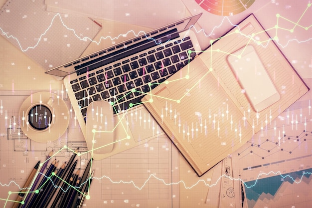 multi exposure of forex chart drawing over table background with computer concept of financial research and analysis top view