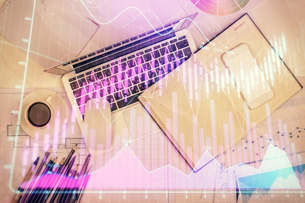 multi exposure of forex chart drawing over table background with computer concept of financial research and analysis top view