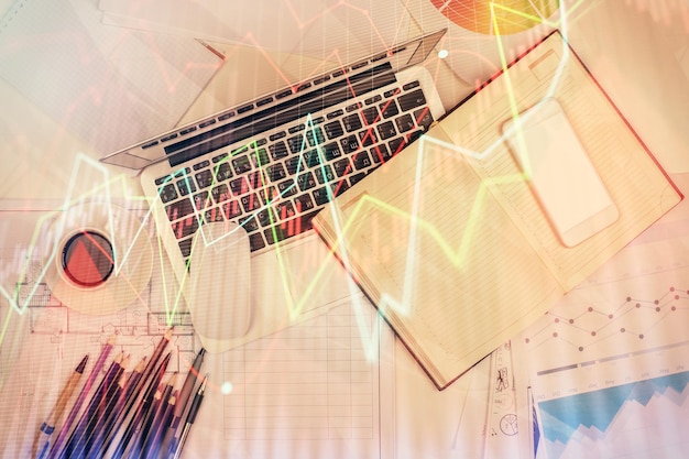 multi exposure of forex chart drawing over table background with computer concept of financial research and analysis top view