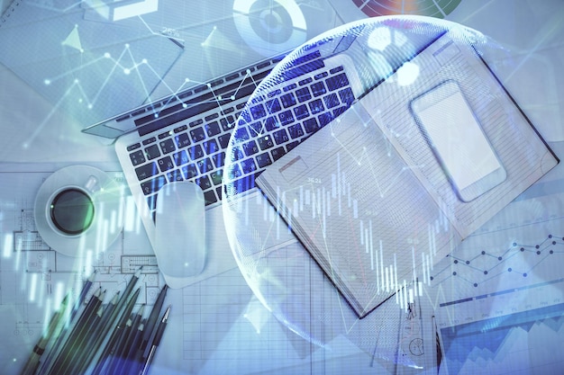 Multi exposure of forex chart drawing over table background with computer Concept of financial research and analysis Top view