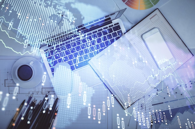 Multi exposure of forex chart drawing over table background with computer Concept of financial research and analysis Top view