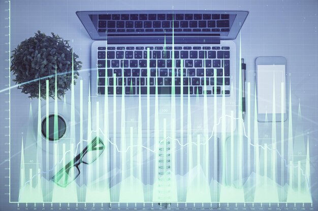 multi exposure of forex chart drawing over table background with computer concept of financial research and analysis top view