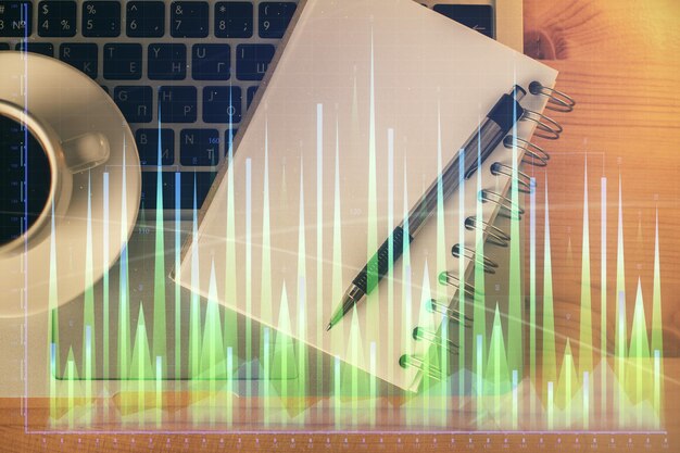 Multi exposure of forex chart drawing and work table top veiw Concept of financial analysis