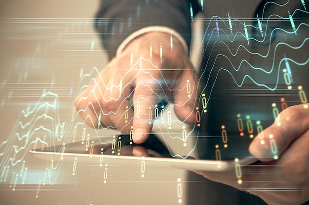 Multi exposure of man's hands holding and using a phone and financial chart drawing Market analysis concept