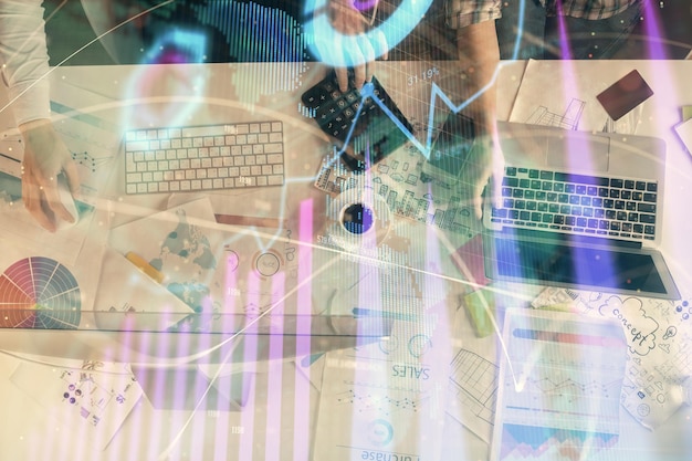 Multi exposure of man and woman working together and financial chart hologram Business concept Computer background