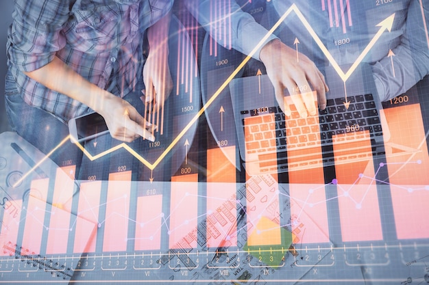 Multi exposure of man and woman working together and forex graph hologram drawing Financial analysis concept Computer background Top View