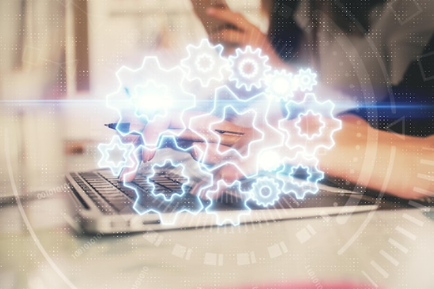 Multi exposure of woman hands typing on computer and business theme hologram drawing Success concept