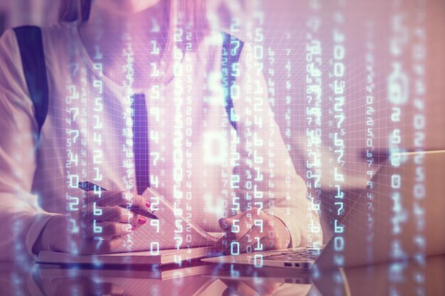 multi exposure of woman hands working on computer and data theme hologram drawing tech concept
