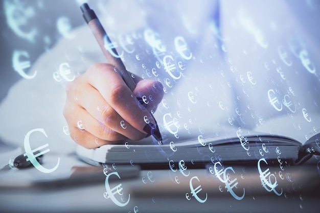 Multi exposure of woman's hands making notes with forex graph hologram Concept stock market analysis