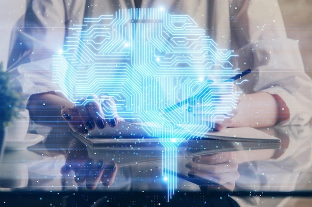 Photo multi exposure of writing hand on background with brain hologram concept of self learning