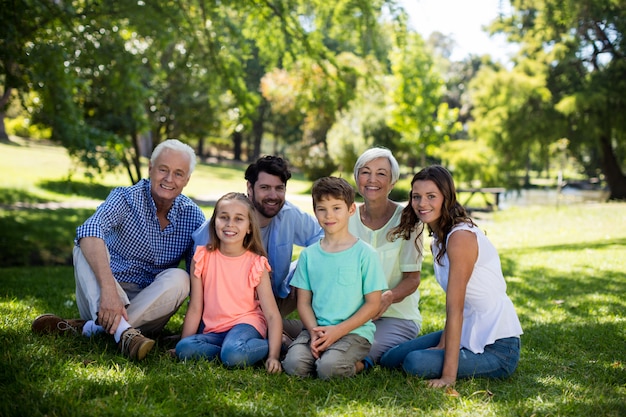 Multi generation family sitting in park