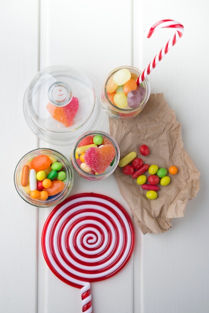 Multicolor candies in glass jars 